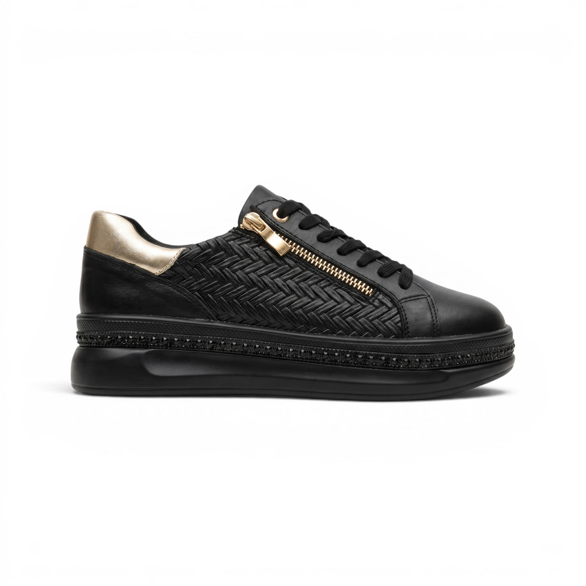 A black leather low-top sneaker with a gold zipper, black laces, and a textured chevron pattern on the side, shown on a white background.