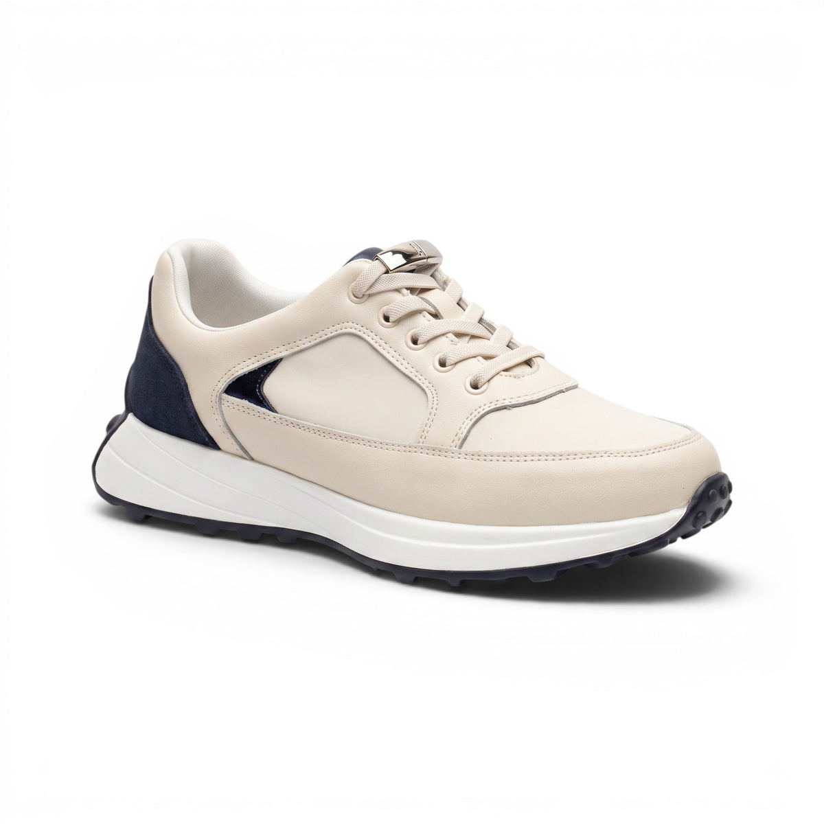A low-top sneaker in off-white leather with navy blue heel and toe accents, a thick white midsole, and a black outsole, shown on a white background.