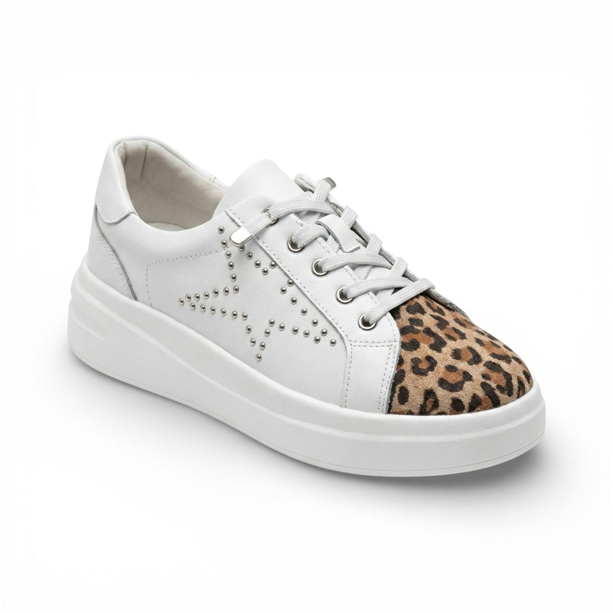 A white low-top platform sneaker with a leopard print pattern on the toe cap and silver metal studs on the side, shown on a white background.