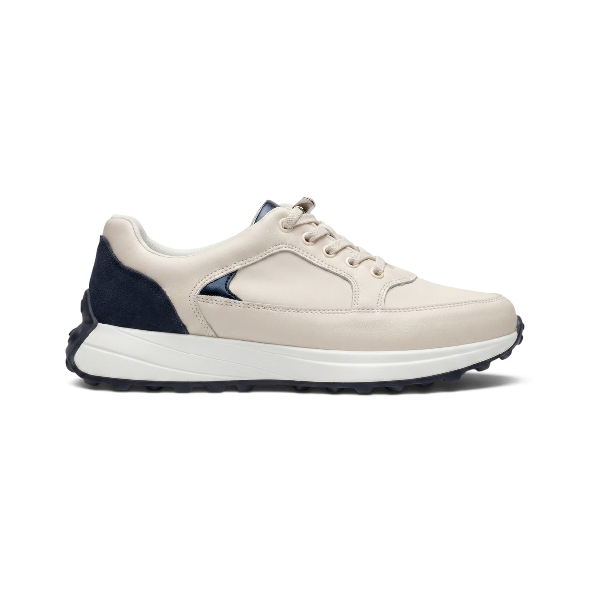 A low-top sneaker in light beige leather with a dark navy heel panel and a thick white midsole, shown in a side profile on a white background.