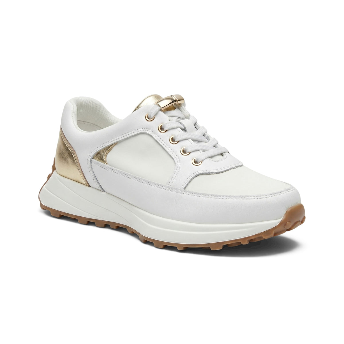 A white low-top sneaker with metallic gold accents on the heel, tongue, and eyelets, featuring a chunky white midsole and a brown outsole, shown on a white background.