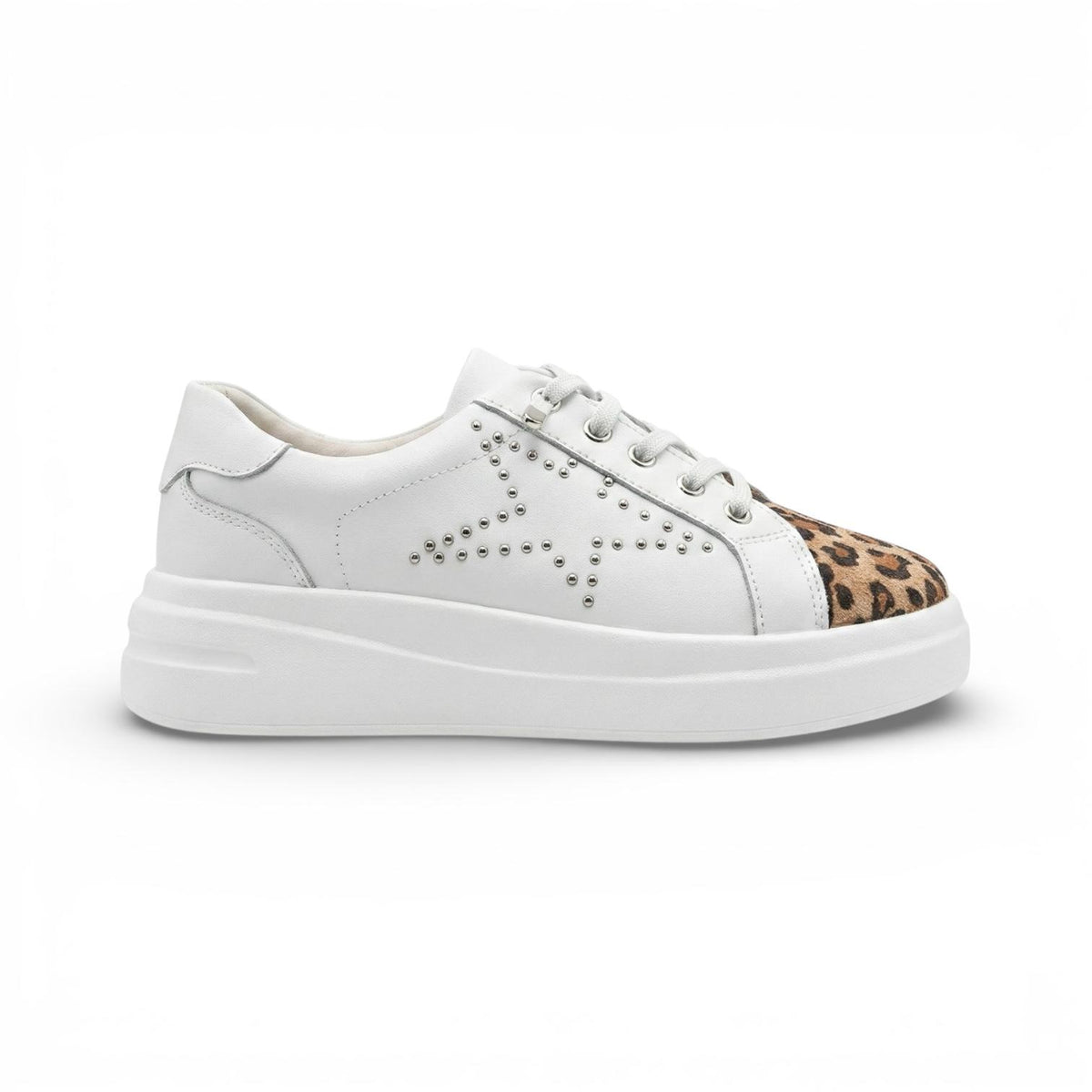 A white low-top platform sneaker with a leopard print toe cap and silver stud detailing on the side, shown from a side profile on a white background.