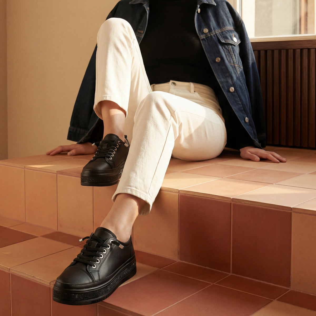 A black diamante platform sneaker with sparkling sole detail, silver-tone hardware and a lightweight cushioned platform for comfortable everyday wear.